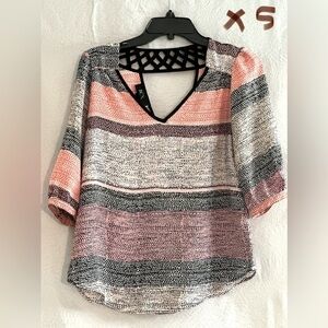 LADIES WHITE TOP WITH BLACK, PINK & MAUVE POLKA DOTS
